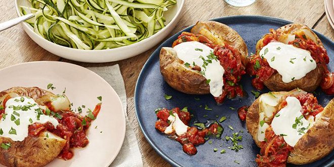 Patatas bravas jackets with a courgette salad.